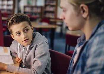 UB student tutoring a child